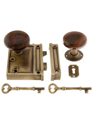 Solid Brass Vertical Rim Lock Set with Bennington Style Porcelain Knobs.